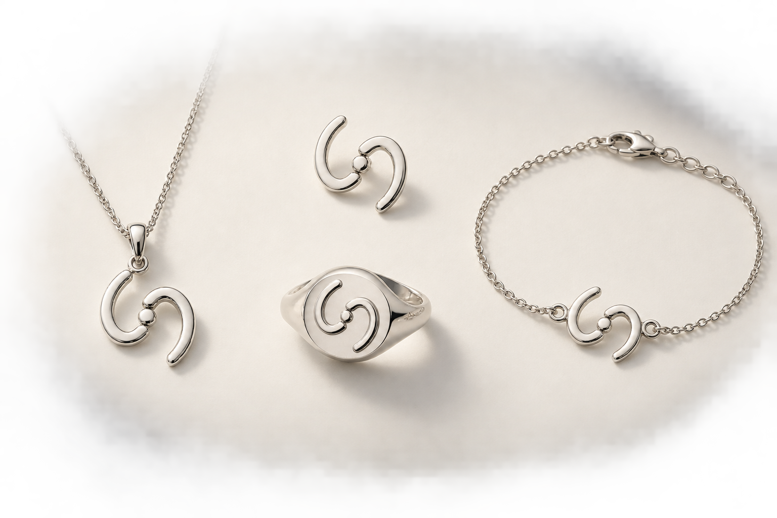 The Meeting Point silver collection: necklace, pin badge, ring and bracelet